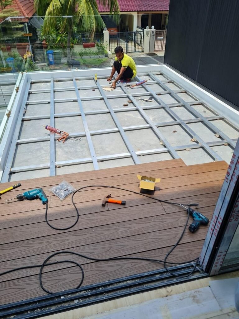 Composite decking installation around a swimming pool in Singapore
