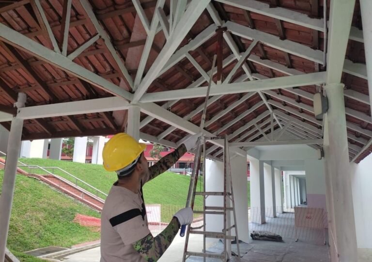 LM Infinite worker repairing a timber roof structure in Singapore